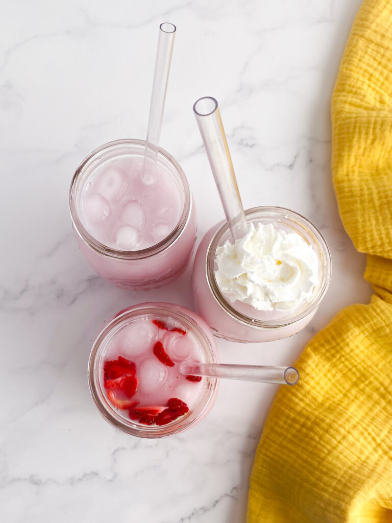 three drinks on a countertop showing the juice in each up