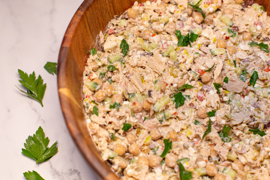 a wooden bowl with tuna salad