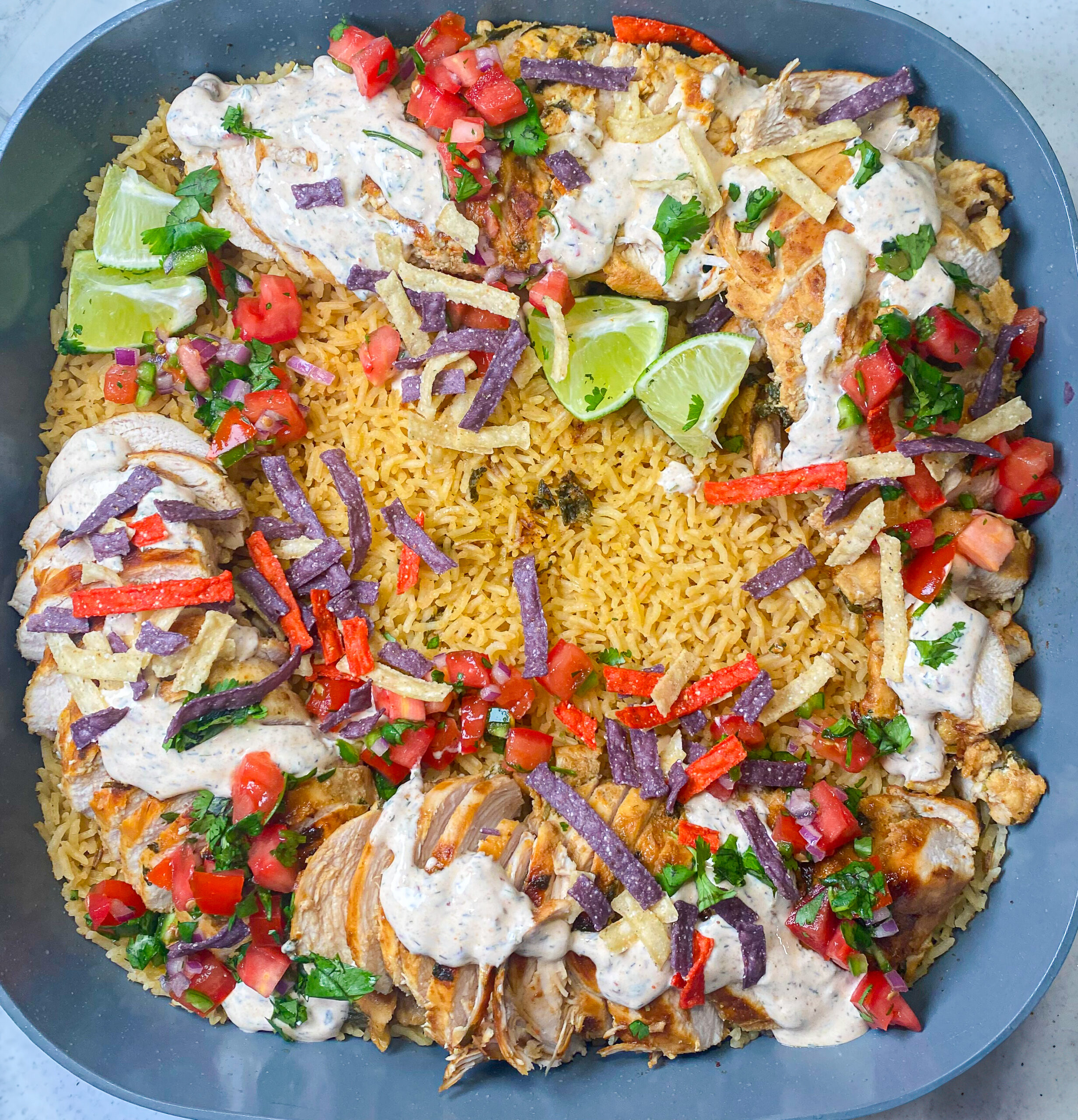 chicken over rice smothered in pico and chipotle ranch