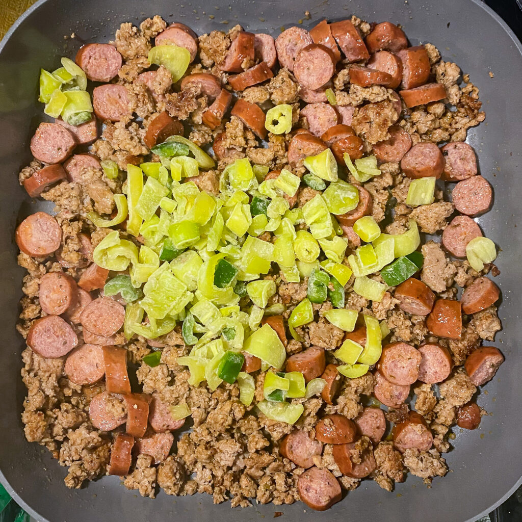 sausage and ground beef topped with chopped peppers