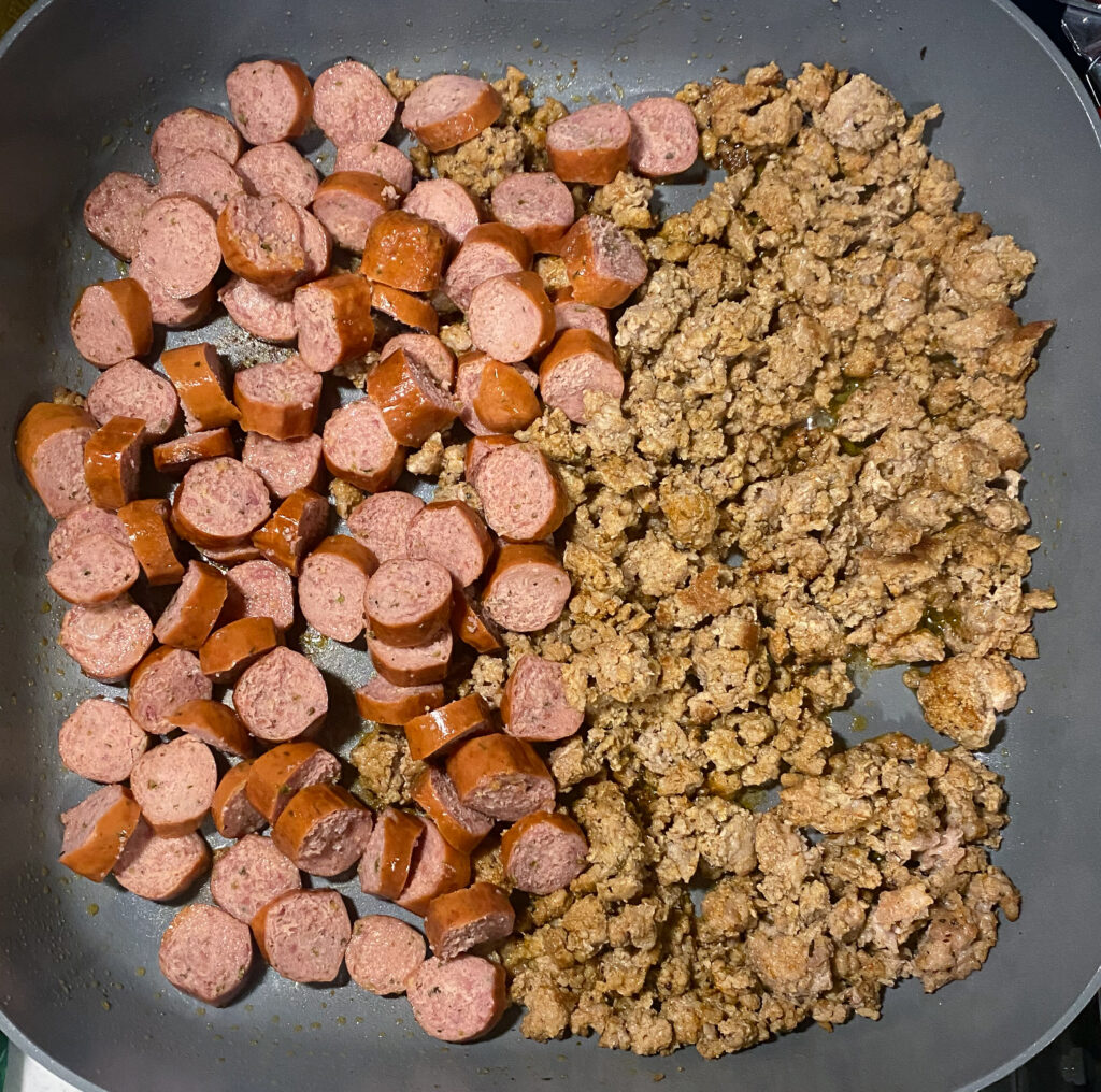 sliced smoked sausage and seasoned ground pork cooked in a skillet