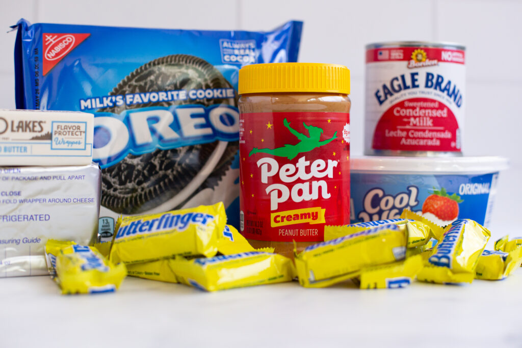 ingredients for the no bake butterfinger pie on a white counter