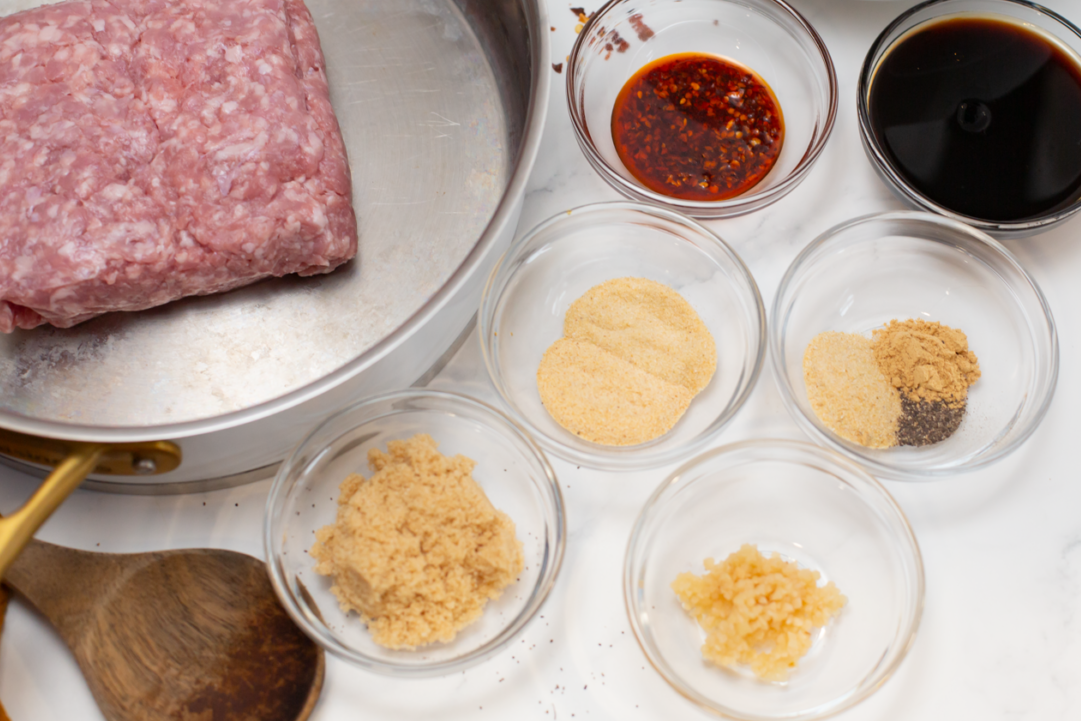 ingredients for asian ground pork and rice on a white counter