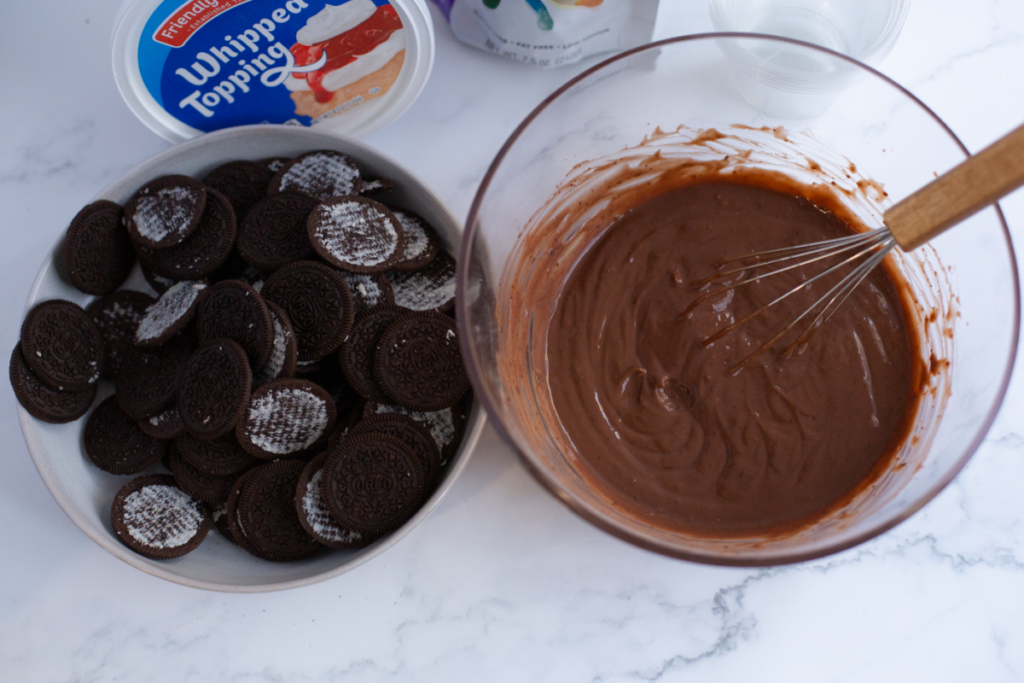 pudding and cookie mix in bowls on a counter