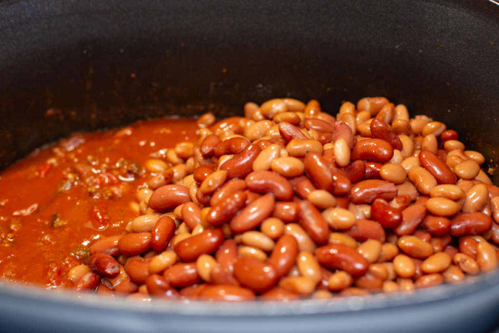 pinto and kidney beans in the pot on top of chili mixture