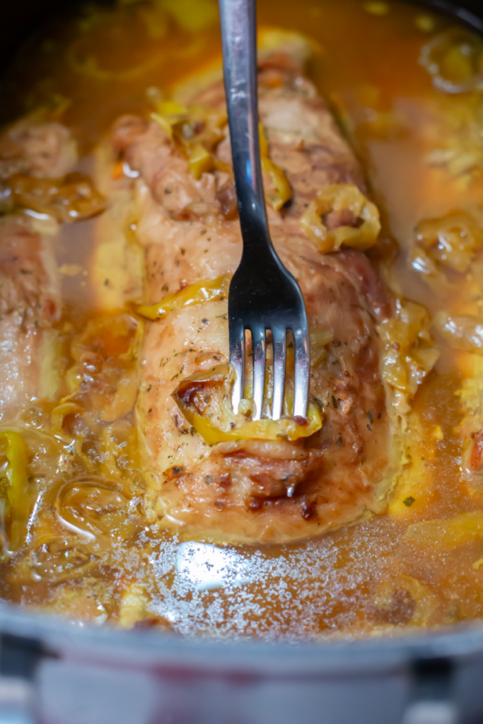 a fork going into the cooked mississippi pork loin