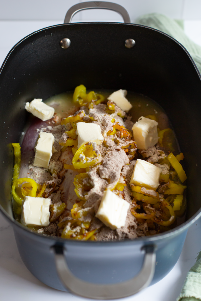 butter all over pork loin in a slow cooker