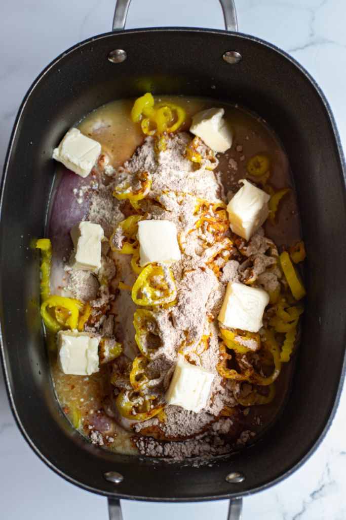 butter all over pork loin in a slow cooker