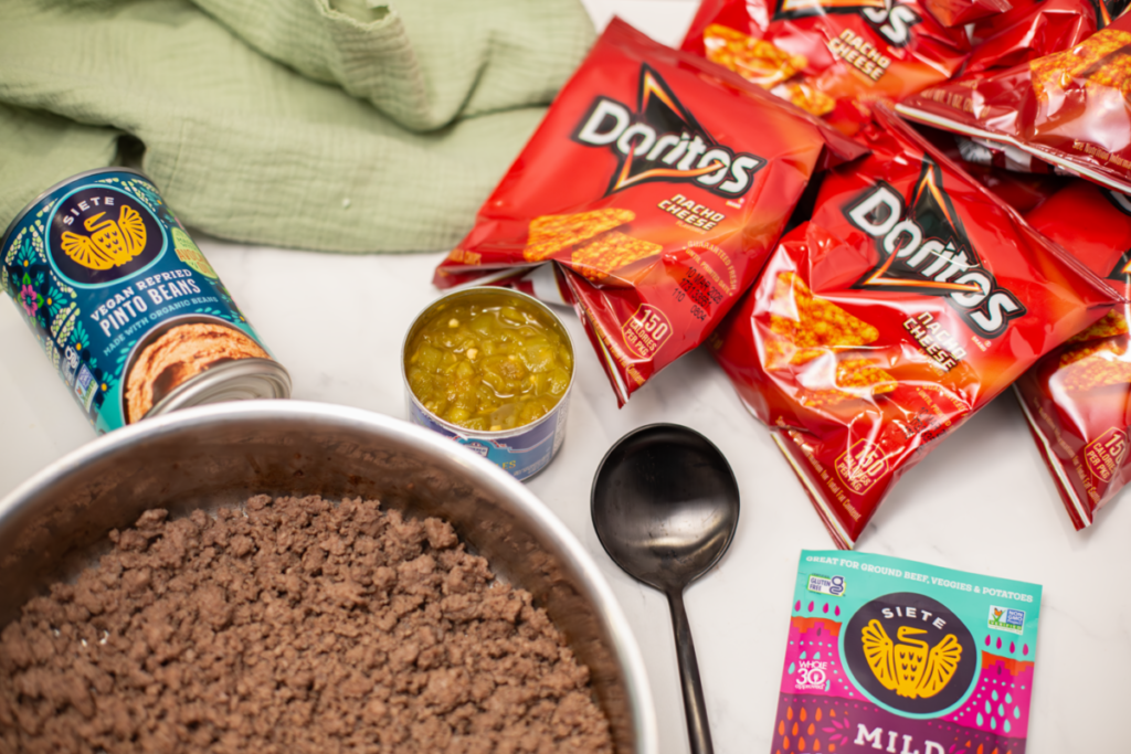 a white counter with walking taco ingredients laying out